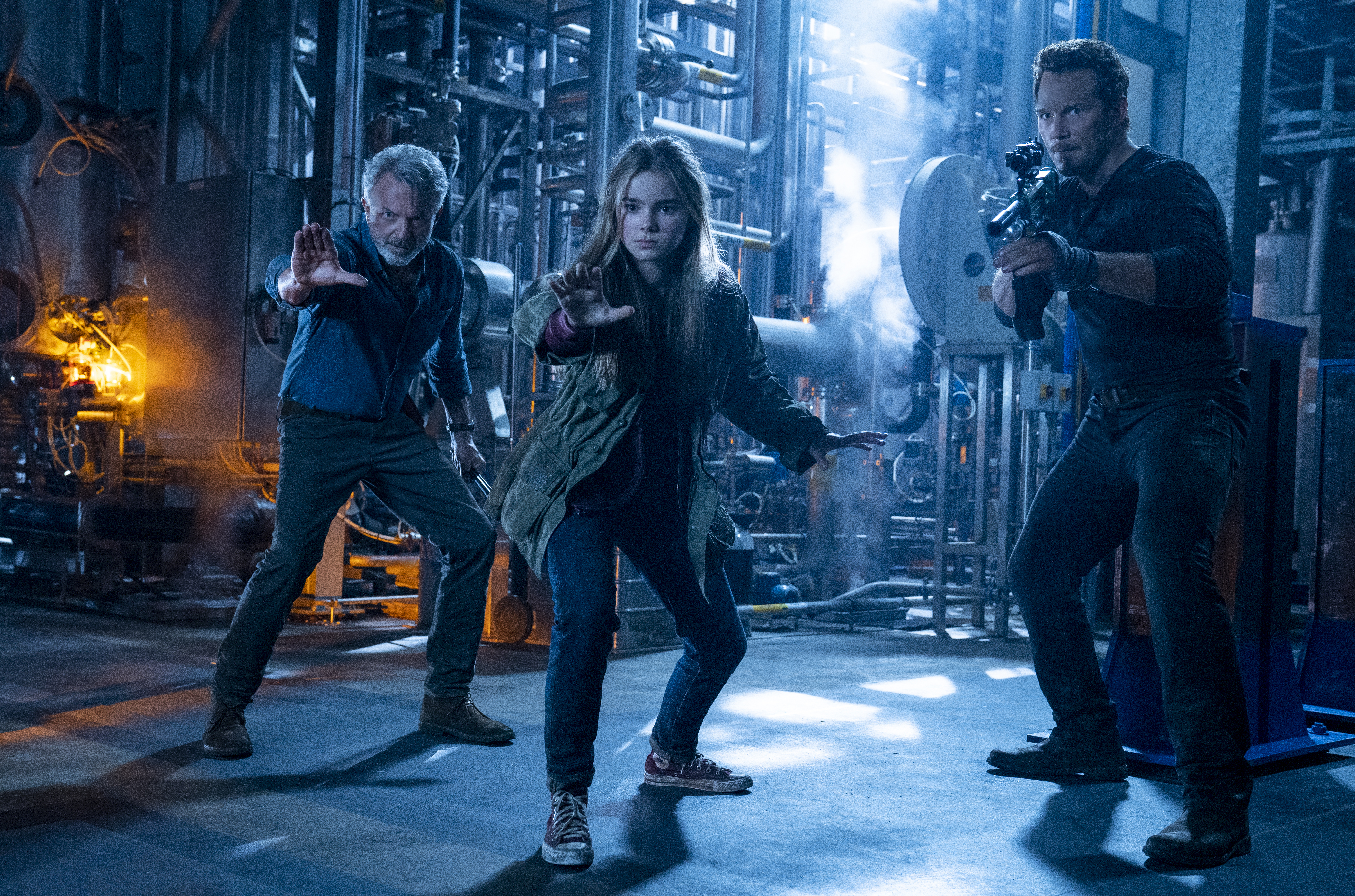 (from left) Dr. Alan Grant (Sam Neill), Maisie Lockwood (Isabella Sermon) and Owen Grady (Chris Pratt) in Jurassic World Dominion, co-written and directed by Colin Trevorrow.